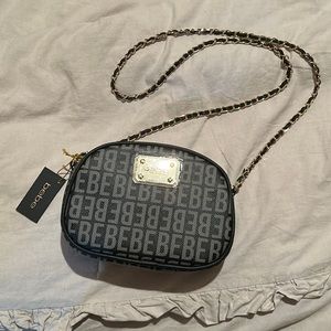 Bebe Black Monogram James Crossbody Oval Camerabag with Woven Gold Chain